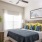 bedroom with large window providing ample lighting