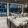 outdoor lounge next to pool, under portico with ceiling fans and can lighting fixtures